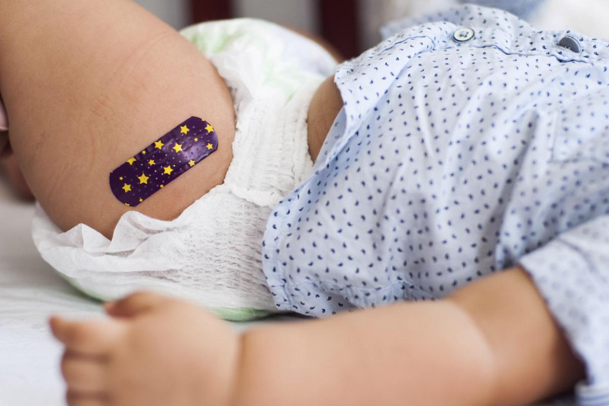Baby with bandage on upper thigh
