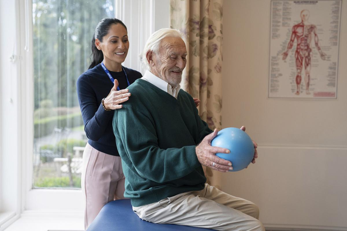 Physical therapist with patient