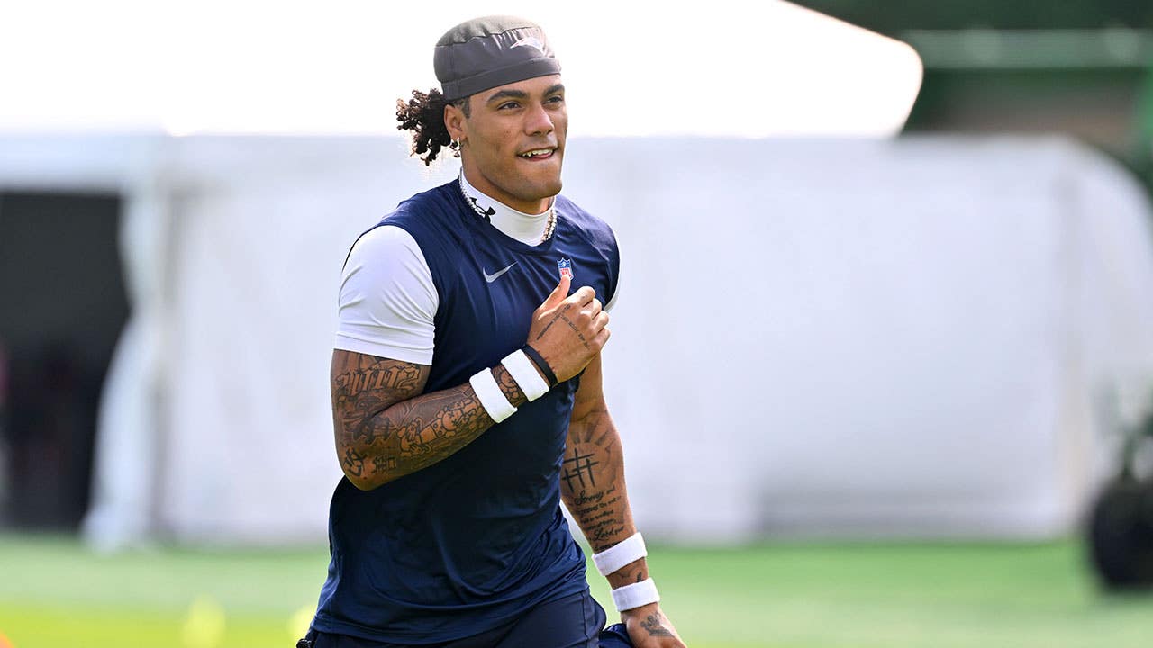 Jul 28, 2026; Foxborough, MA, USA; New England Patriots cornerback Christian Gonzalez (0) walks to practice for training camp at Gillette Stadium. Mandatory Credit: Eric Canha-Imagn Images