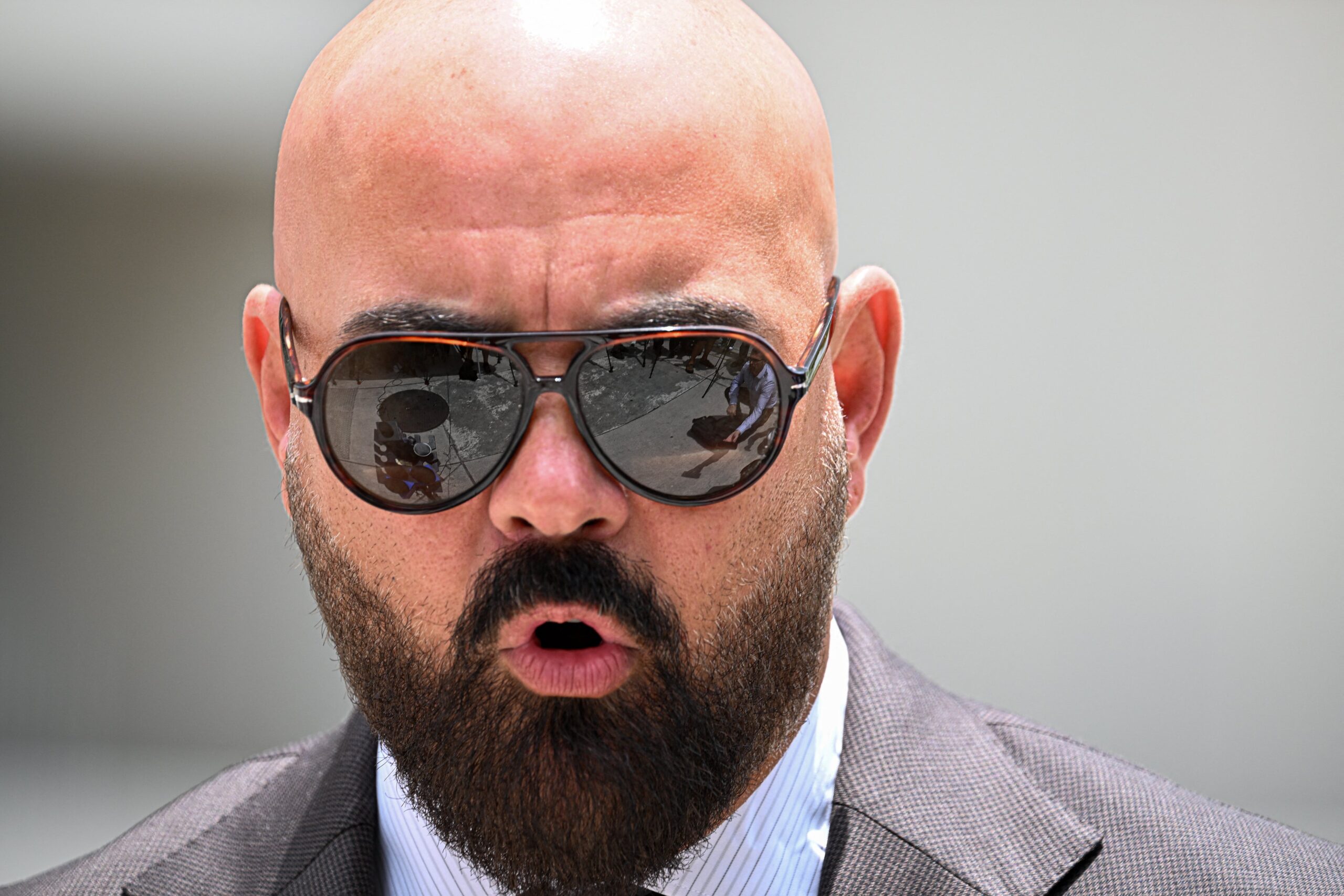 Joseph D. McBride, attorney for Andrew Tate and Tristan Tate, speaks to the press following an extradition hearing for the Tate brothers at the C. Clyde Atkins US Courthouse in Miami, Florida, on July 27