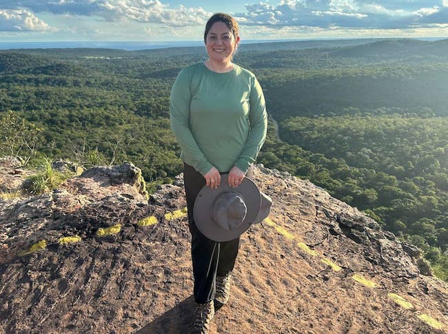 A reviewer wearing the shirt on a hike