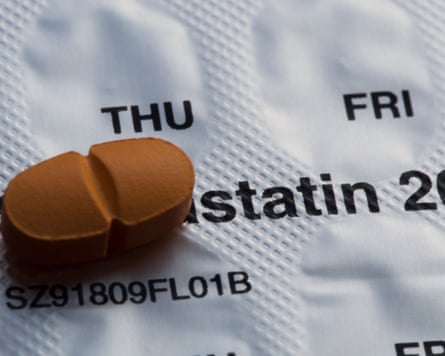 A statin tablet against a blister pack with the word statin showing.