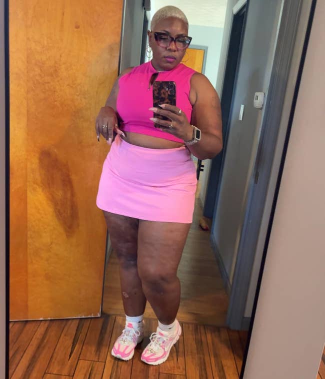 A reviewer wearing the skirt indoors