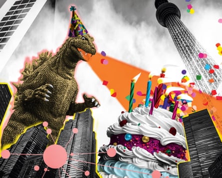 Godzilla in a party hat blows out candles on a birthday cake