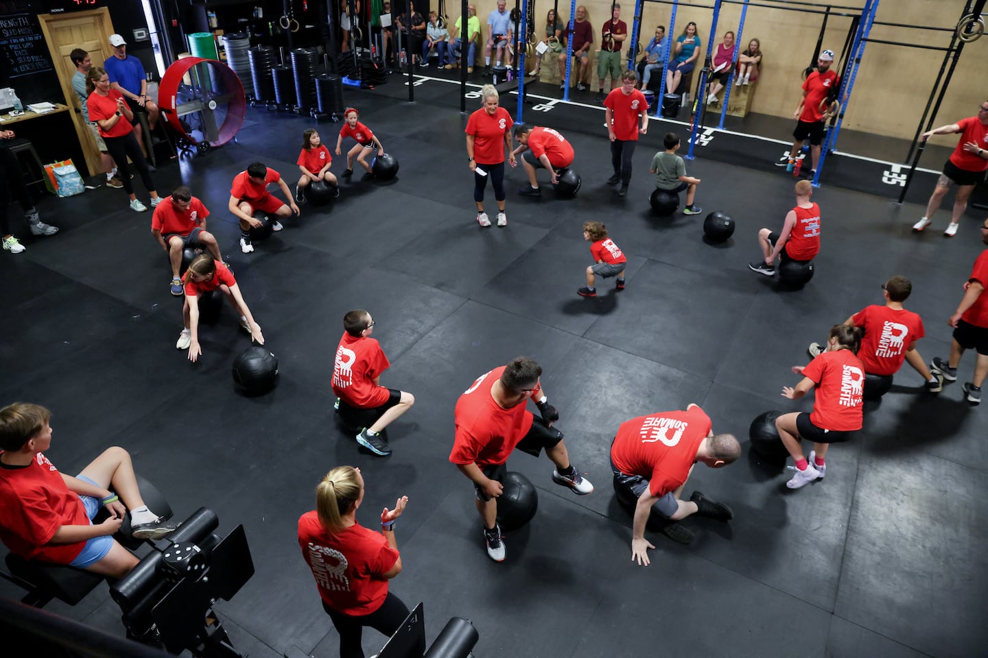 Lead instructor Donna Faucher leads a musical medicine balls game at the free functional fitness program at Southern Mass. Functional Fitness.