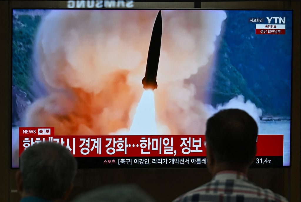 People watch a television screen showing file footage of a North Korean missile test, at a railway station in Seoul in August. North Korea fired around 10 short-range ballistic missiles on August 20. Photo: AFP/Getty Images/TNS