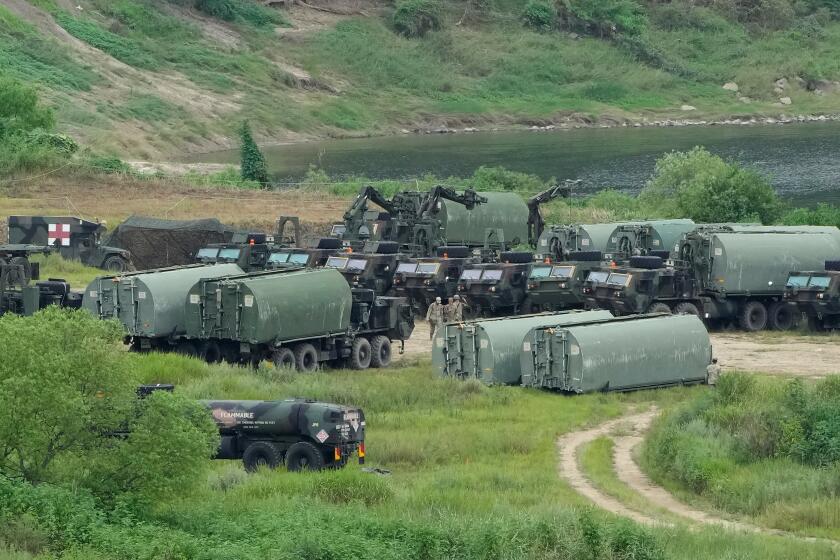U.S. Army's armored vehicles gather to cross a river at a training field in Yeoncheon, South Korea, near the border with North Korea, Monday, Aug. 17, 2026. (AP Photo/Ahn Young-joon)