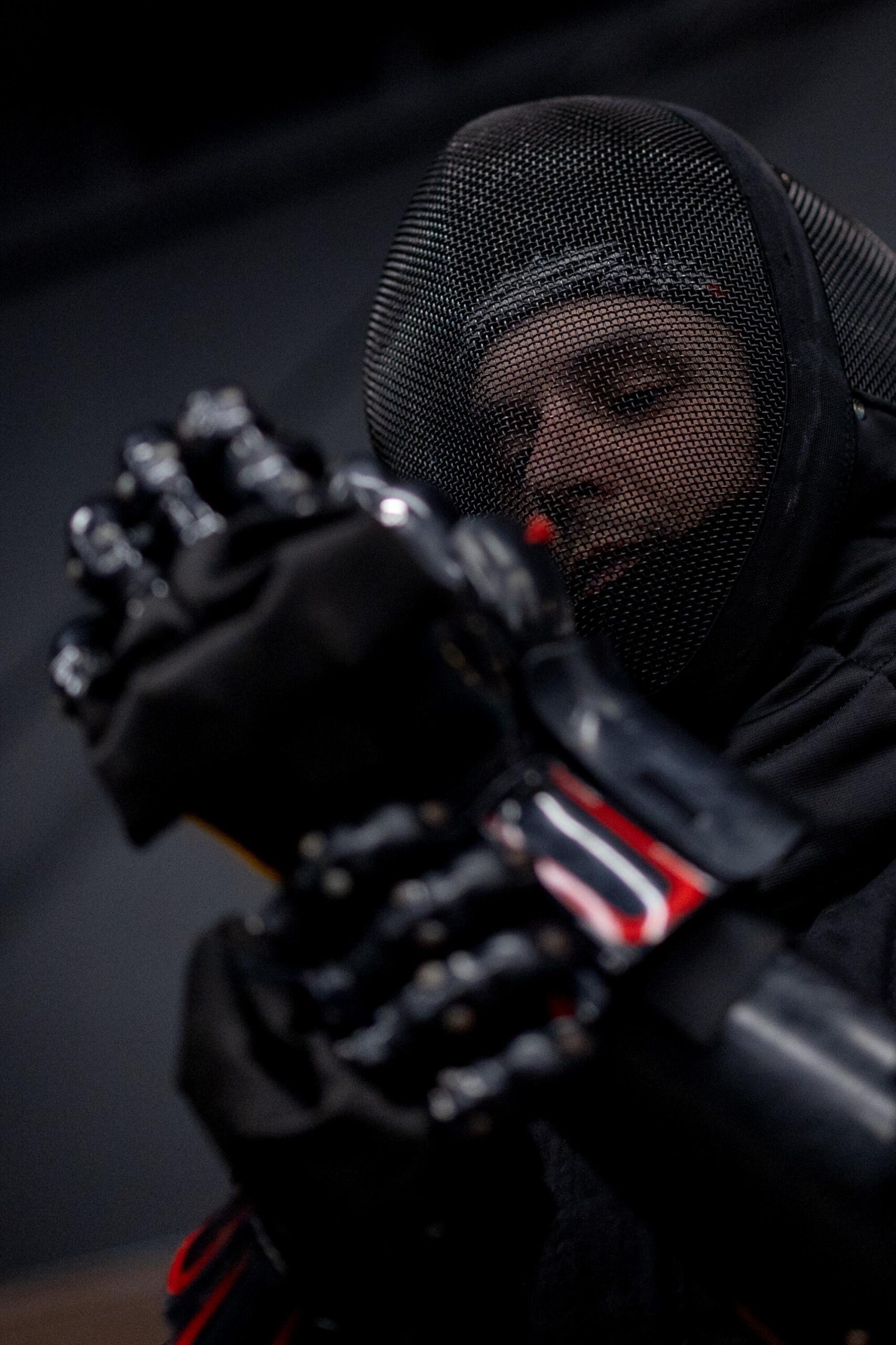 Alex Blugerman puts on protective gear before a class at Swordplay LA.
