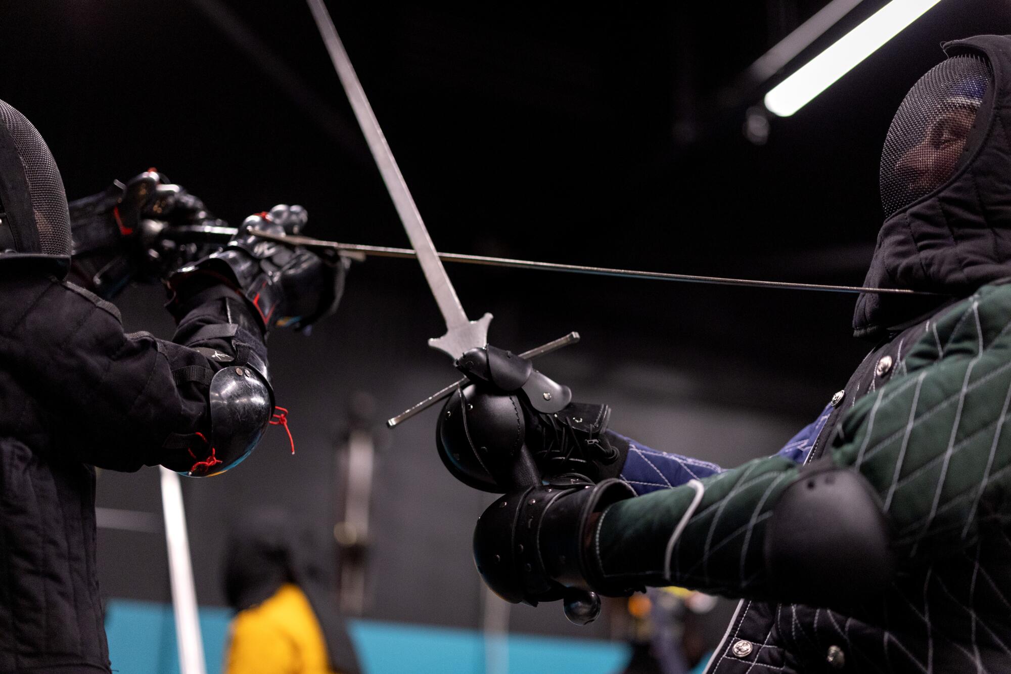 Alex Blugerman, left, and Aiden Kelly duel during a class at Swordplay LA.