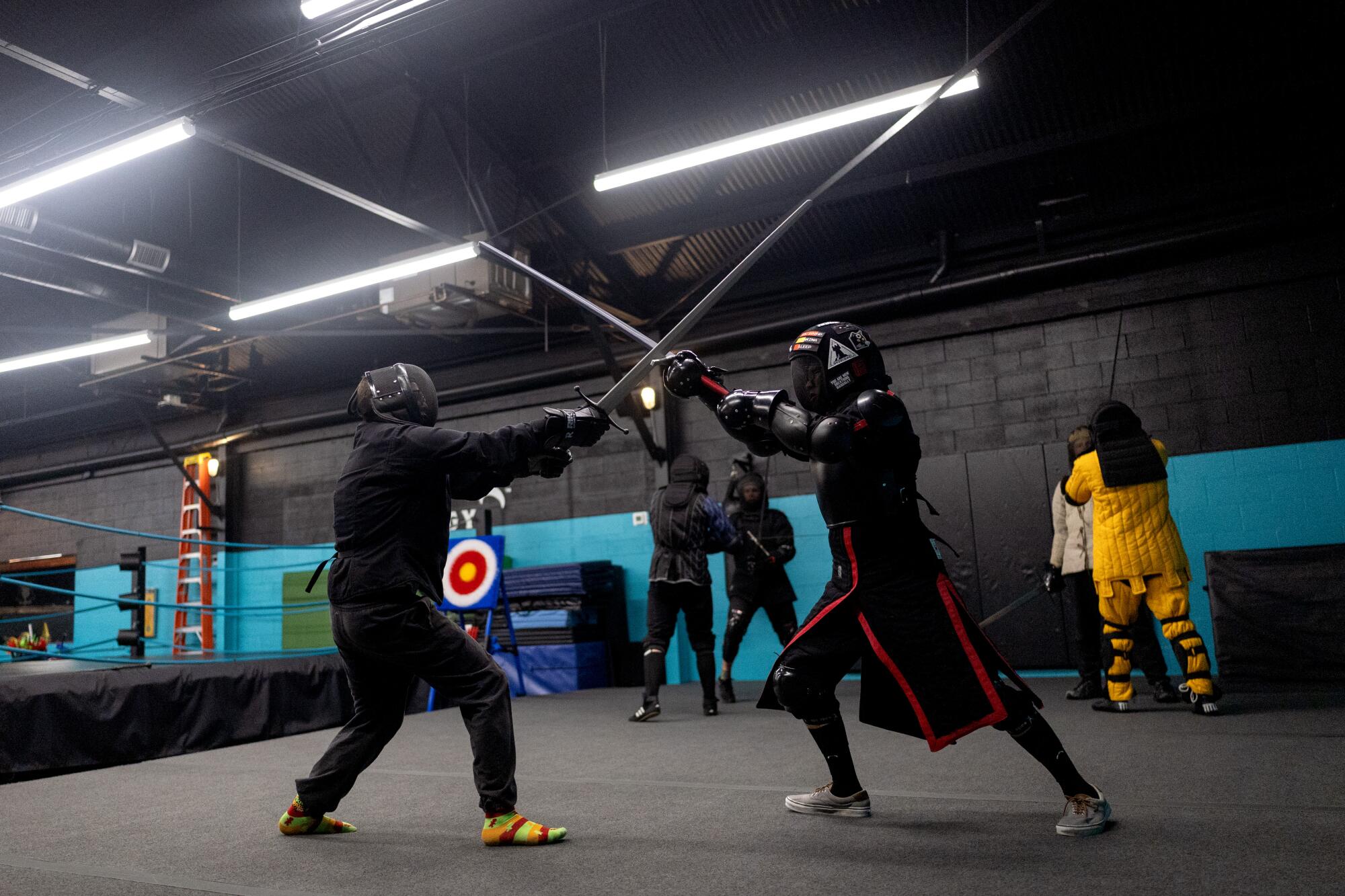 Jonathan Proft, left, and Traviss Nguyen duel.