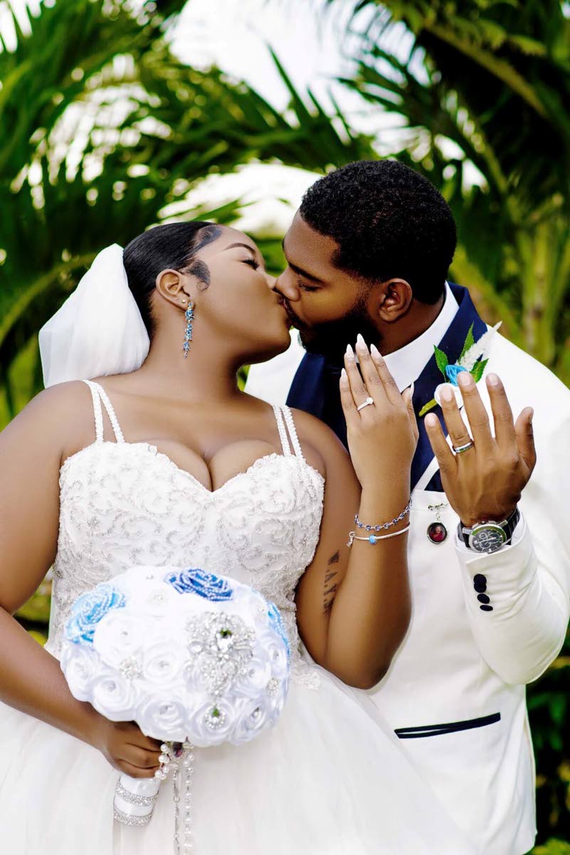 Mr and Mrs Mair share a kiss as they celebrate the beginning of their journey as husband and wife.