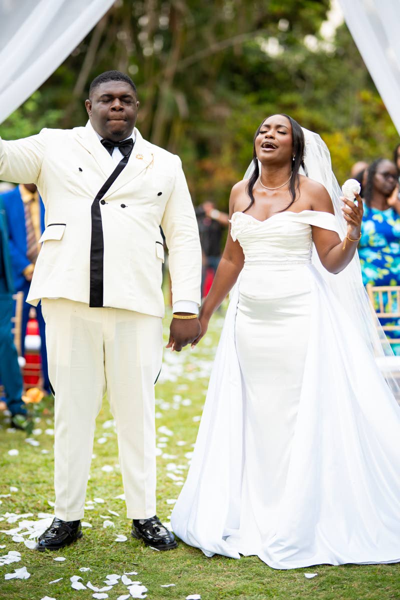 The couple worships together during their wedding ceremony.