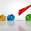 Developing Business Potential and Individual creativity concept and creative innovator or new thinking as a symbol of innovation and inspiration metaphor as a group of crumpled papers with one different paper transforming into an airplane.
