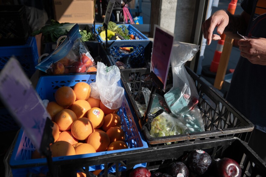 Baskets of fruit and vegetables are handed out at North Helpline's Lake City Food Bank, where demand for services has grown in recent months.