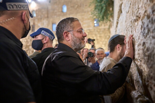 Israel's Minister of National Security, Itamar Ben-Gvir, prays during the mourning ritual of Tisha B'Av at the Western Wall, Judaism's holiest site, in Jerusalem's Old City, Wednesday, July 22, 2026. (AP Photo/Ohad Zwigenberg)