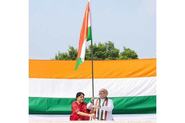 Union Minister Amit Shah hoists Tiranga at his residence under Har Ghar Tiranga campaign