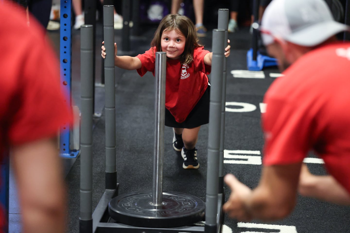 Olivia Limoli, 8, participates in the sled push at the at SoMAFit.