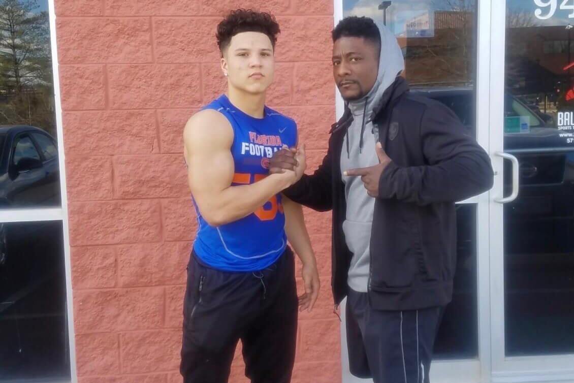 Rams running back Blake Corum (right) and longtime trainer Kevin Johnson.