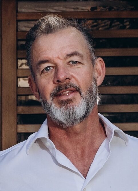 Bearded man in white shirt