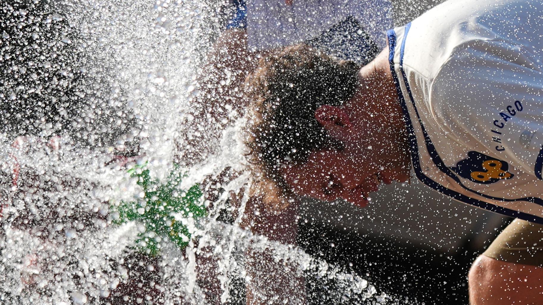 A person cools off in front of a Chicago Fire Department during a hot weather day in Chicago, June 30, 2026. (AP Photo / Nam Y. Huh, File)