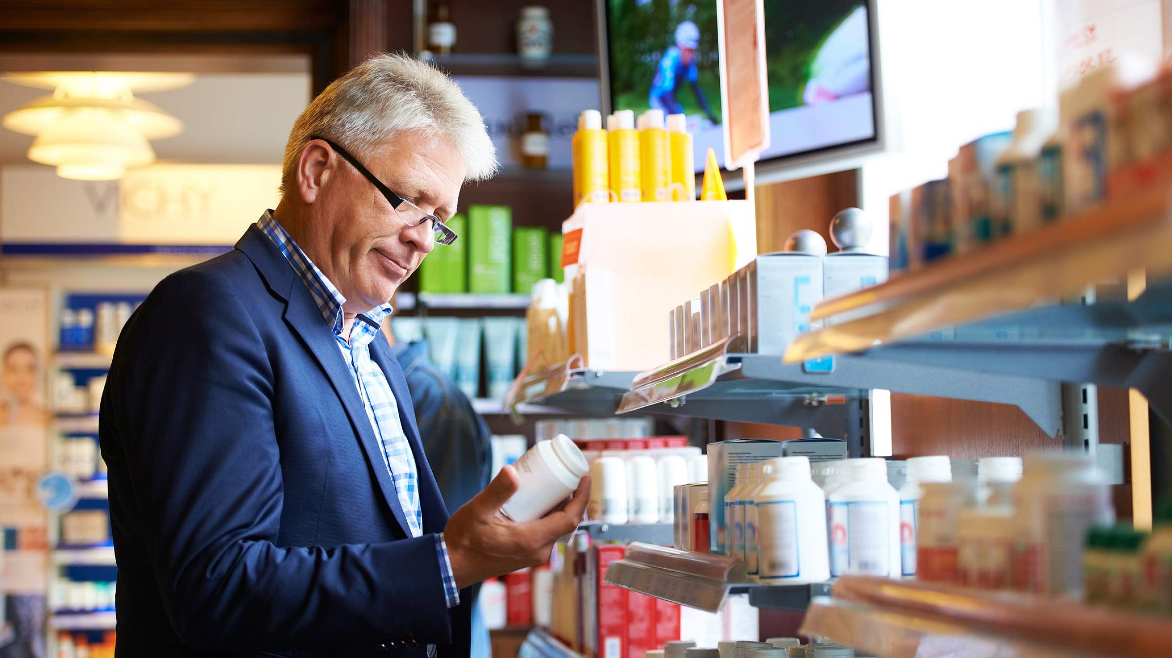 mature man shopping for vitamins supplements