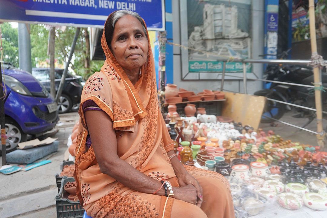 Kamlesh Devi spends up to 12 hours each day at her roadside stall in Delhi, where rising temperatures are taking a toll on her health and livelihood. Credit: Safina Nabi