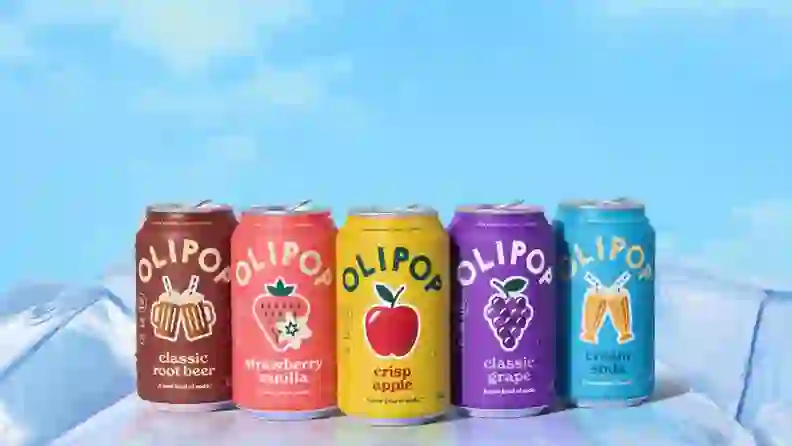 Row of Olipop soda cans in five flavors on ice