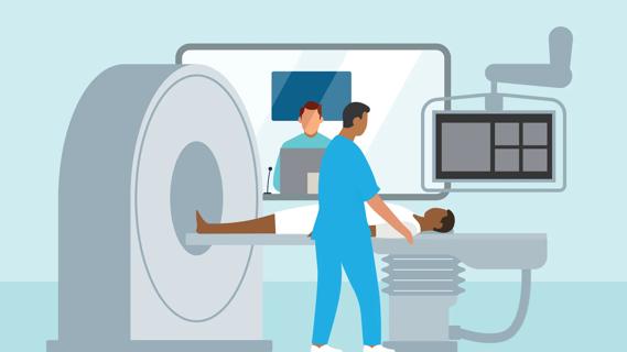 Patient on PET scan table, being prepping by healthcare provider to undergo a scan