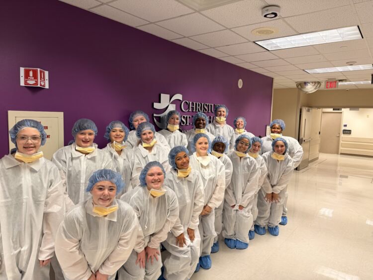 Texarkana's MASH students line up, wearing their scrubs.