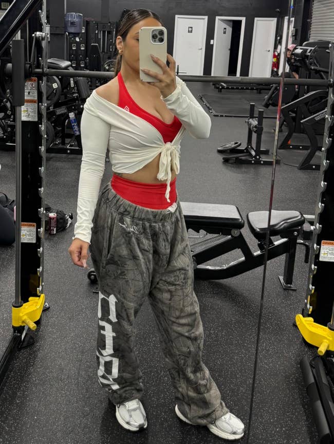 A reviewer wearing the coverup at the gym