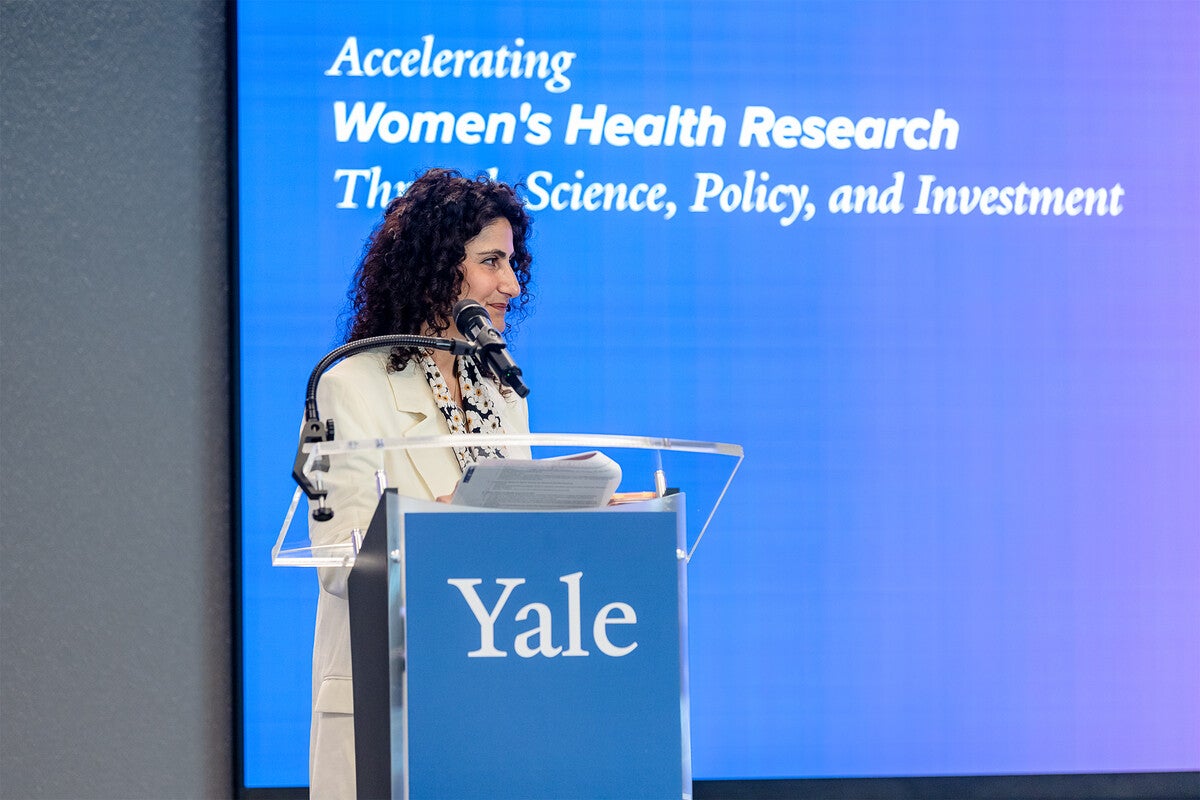 Basmah Safdar at a podium