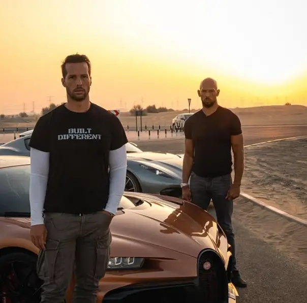 The Tates posing in front of supercars (Instagram/notristantate)