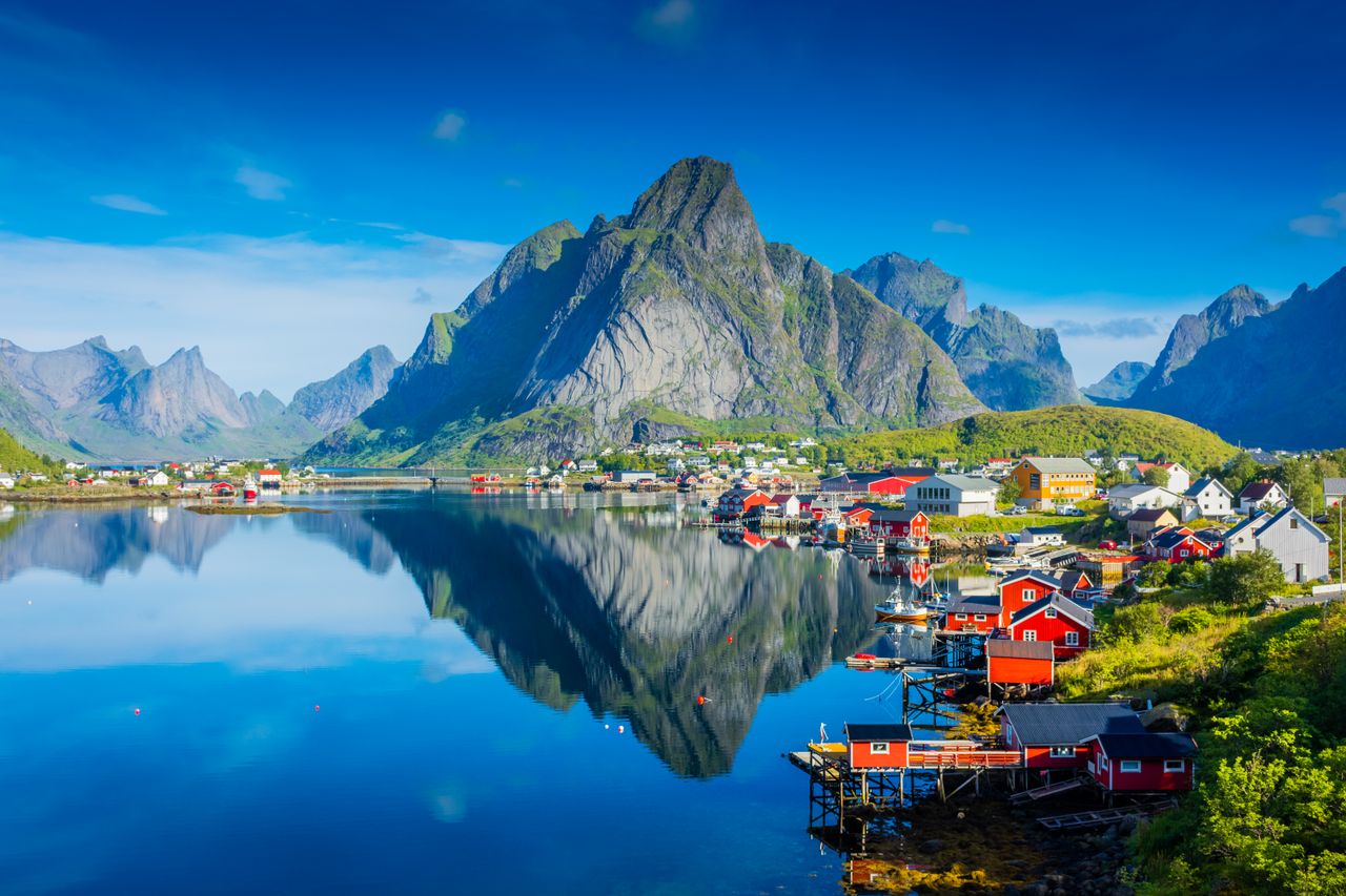 Reine village hugs the coast of the fjord in Lofoten Islands, Norway.Credit: StefanoZaccaria / Getty Images