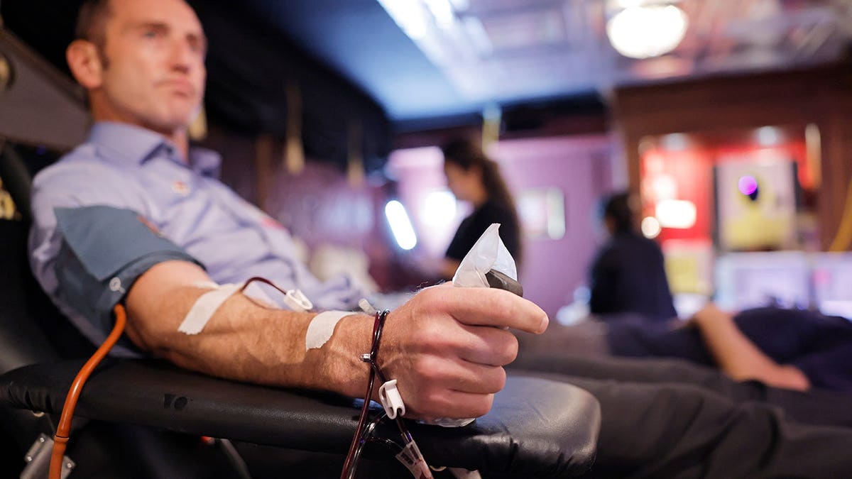 Volunteer donates blood during American Red Cross blood drive at Hollywood's Magic Castle.