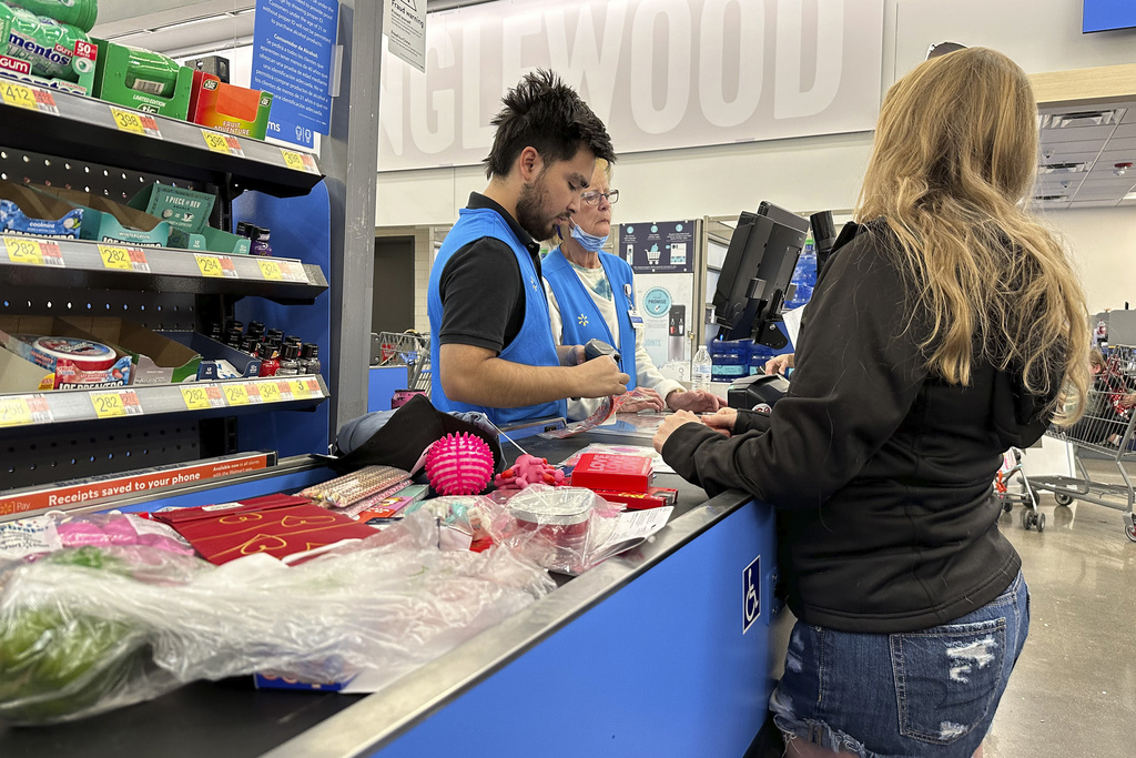 FILE - A customer checks out of a Walmart store Wednesday, Feb. 21, 2024, in Englewood, Colo. On Wednesday, May 15, 2024, the Commerce Department releases U.S. retail sales data for April.