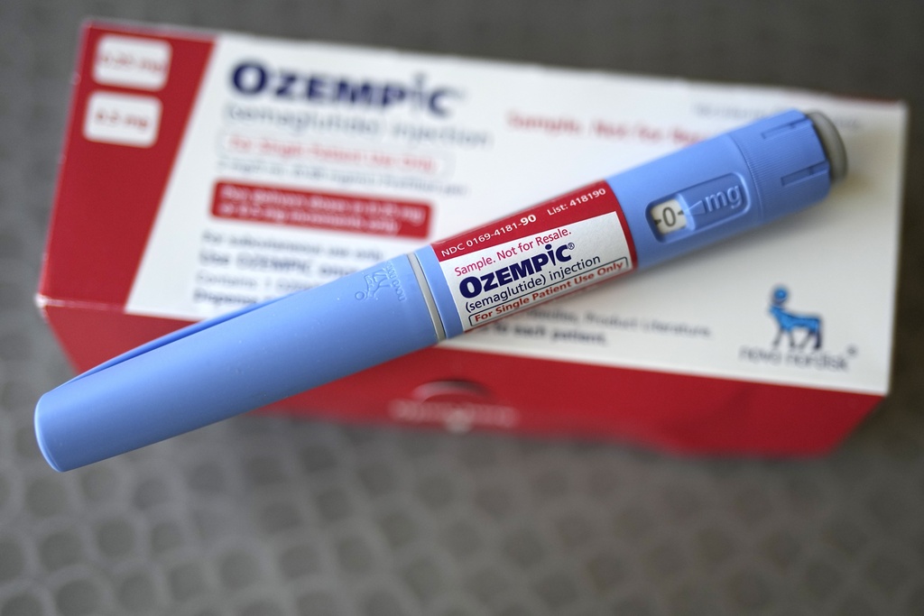 Ozempic injectable sits on the medication box