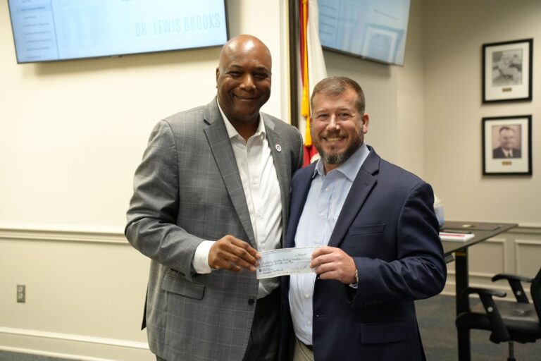 Montevallo delivers $2M check to BOE for new gym at high sch...