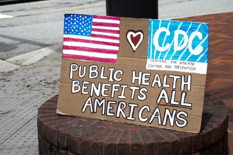 A sign sits on a lamp post, as community members come out to pay their respects for David Rose, an officer killed on August 8th, in Atlanta, Georgia, while stopping a gunman who was shooting at the Center of Disease Control and Prevention (CDC) in Atlanta, Georgia, on August 11, 2025.
