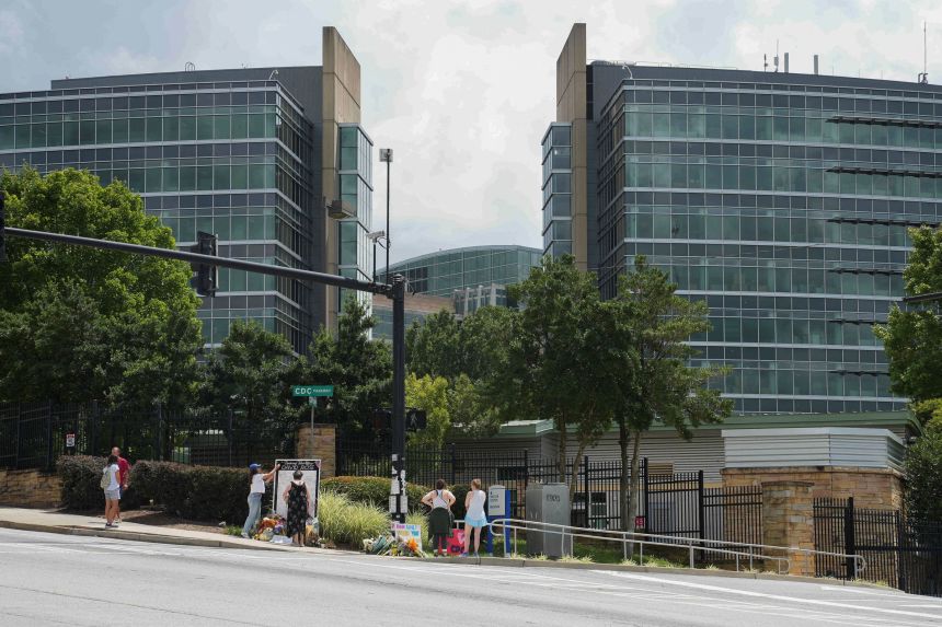 Community members come out to pay their respects for David Rose, an officer killed on August 8th, in Atlanta, Georgia, while stopping a gunman who was shooting at the Center of Disease Control and Prevention in Atlanta, Georgia, on August 11, 2025.