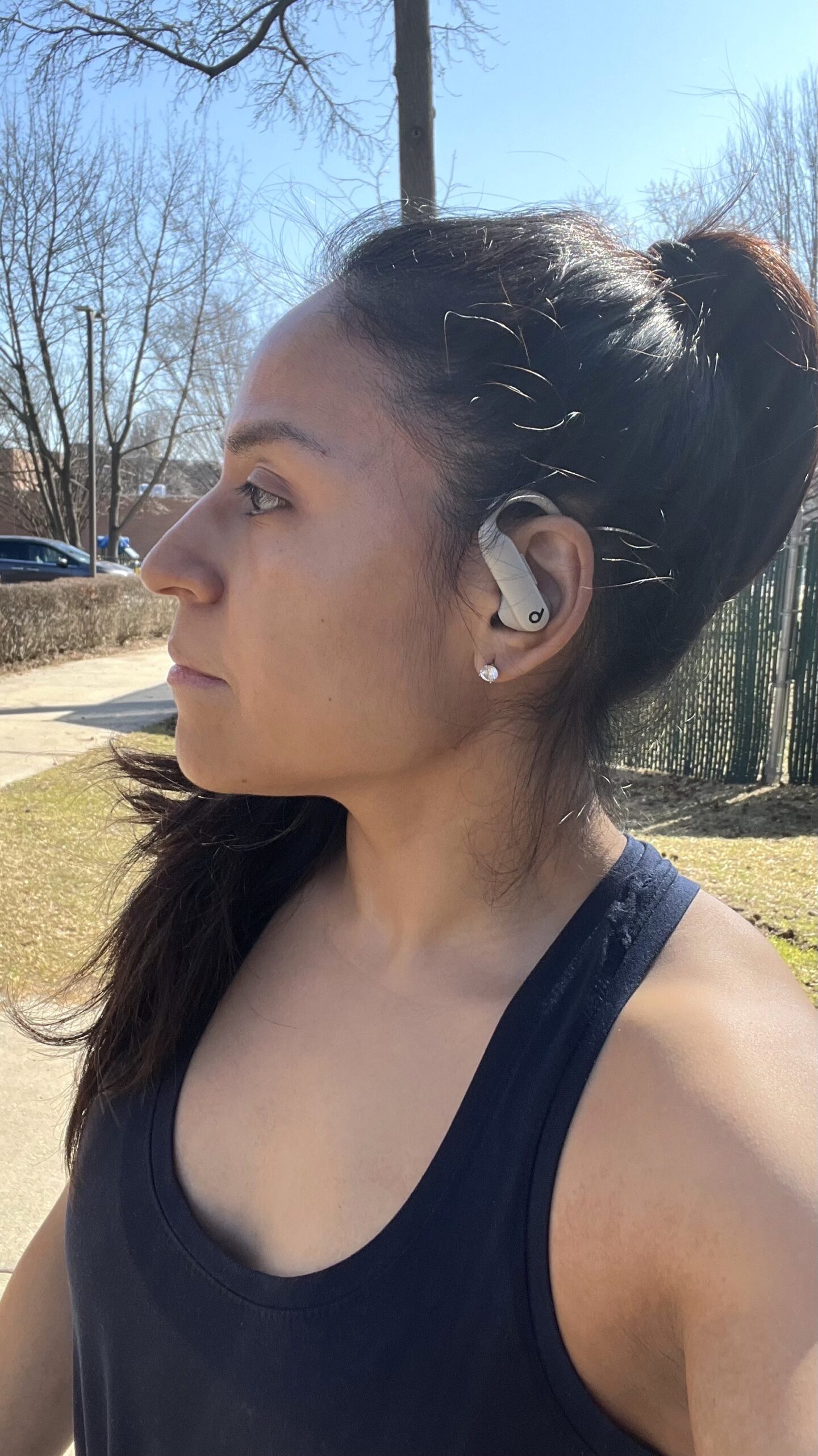 Woman wearing beige Powerbeats Pro 2