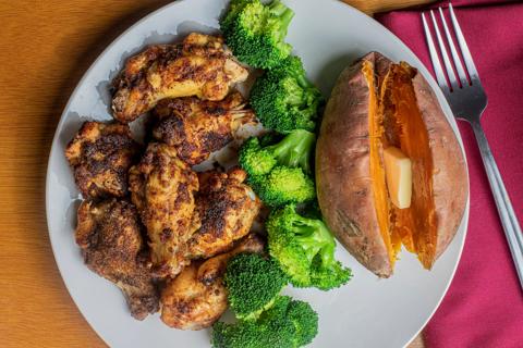 Plate of chicken, broccoli and a baked sweet potato