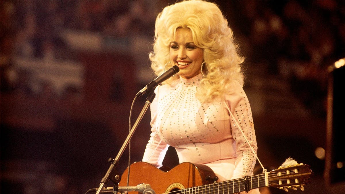 Dolly Parton performs in 1976.