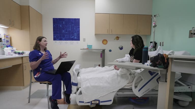 Dr. Melanie Cree explains medical results to Noelani Schulmeister in a study using GLP-1 medication.