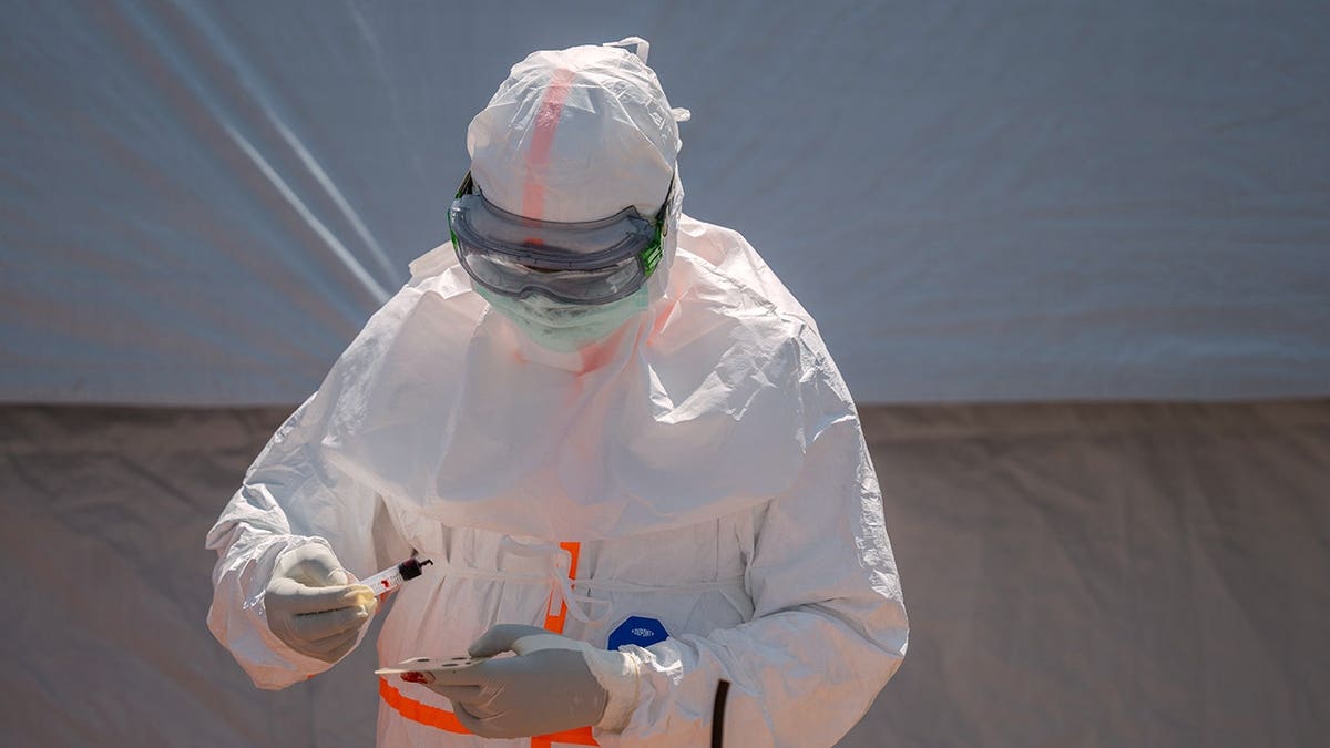 Health worker prepares a blood sample at Bunia General Hospital in Bunia, Congo.
