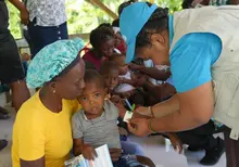 FILE PHOTO: A child gets screened for malnutrition with a MUAC in a UNICEF-supported mobile clinic in Boucan Carré, Haiti, 2025