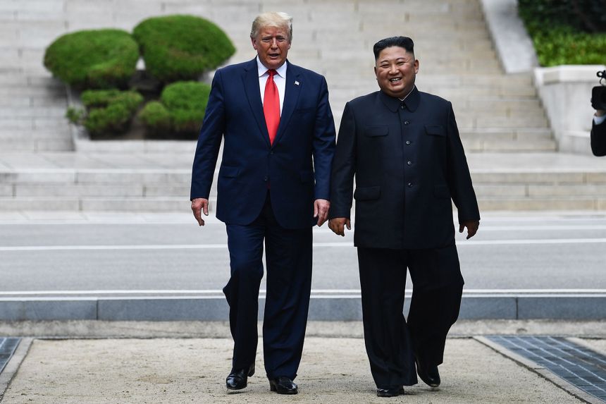 North Korea's leader Kim Jong Un walks with US President Donald Trump north of the Military Demarcation Line that divides North and South Korea, in the Joint Security Area (JSA) of Panmunjom in the Demilitarized zone (DMZ) on June 30, 2019.