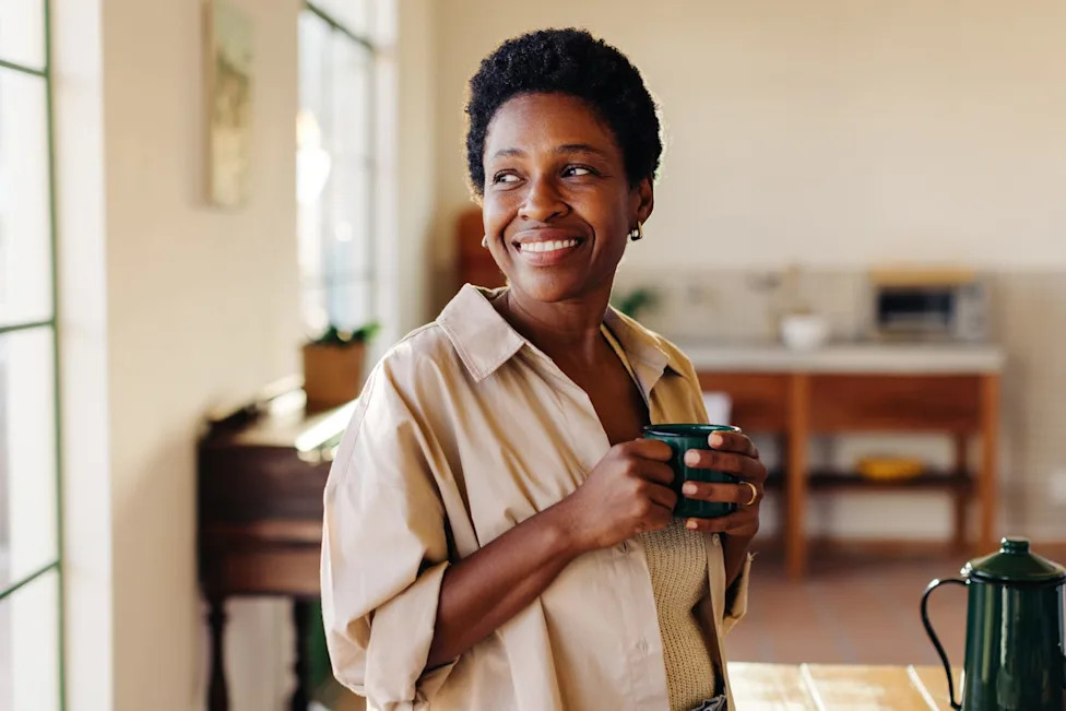 woman enjoying morning coffee at home