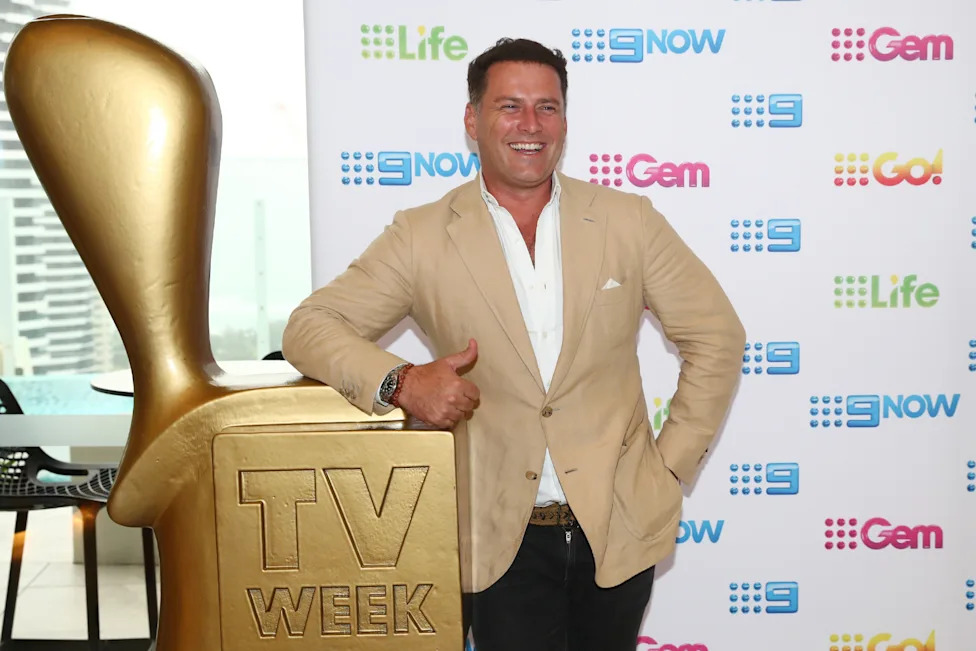 Karl Stefanovic standing next to a Logie Award