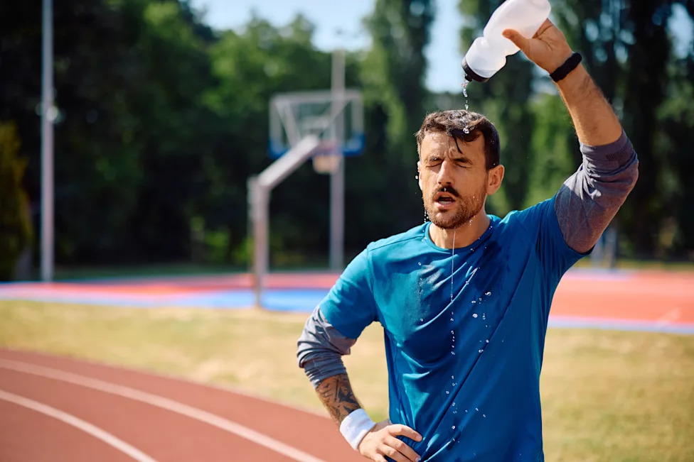 Exhausted,Sportsman,Refreshing,Himself,While,Pouring,Water,Onto,His,Head