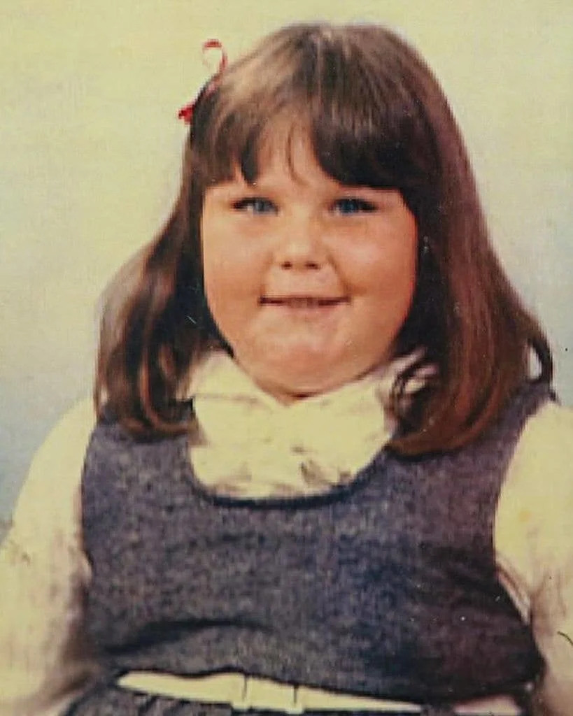 Chrissy Metz in a school photo with bangs and smiling